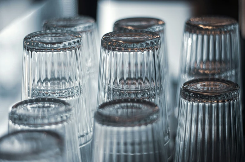 a group of crystal glass vases with different types of sizes