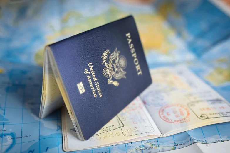 a passport sitting on top of a map