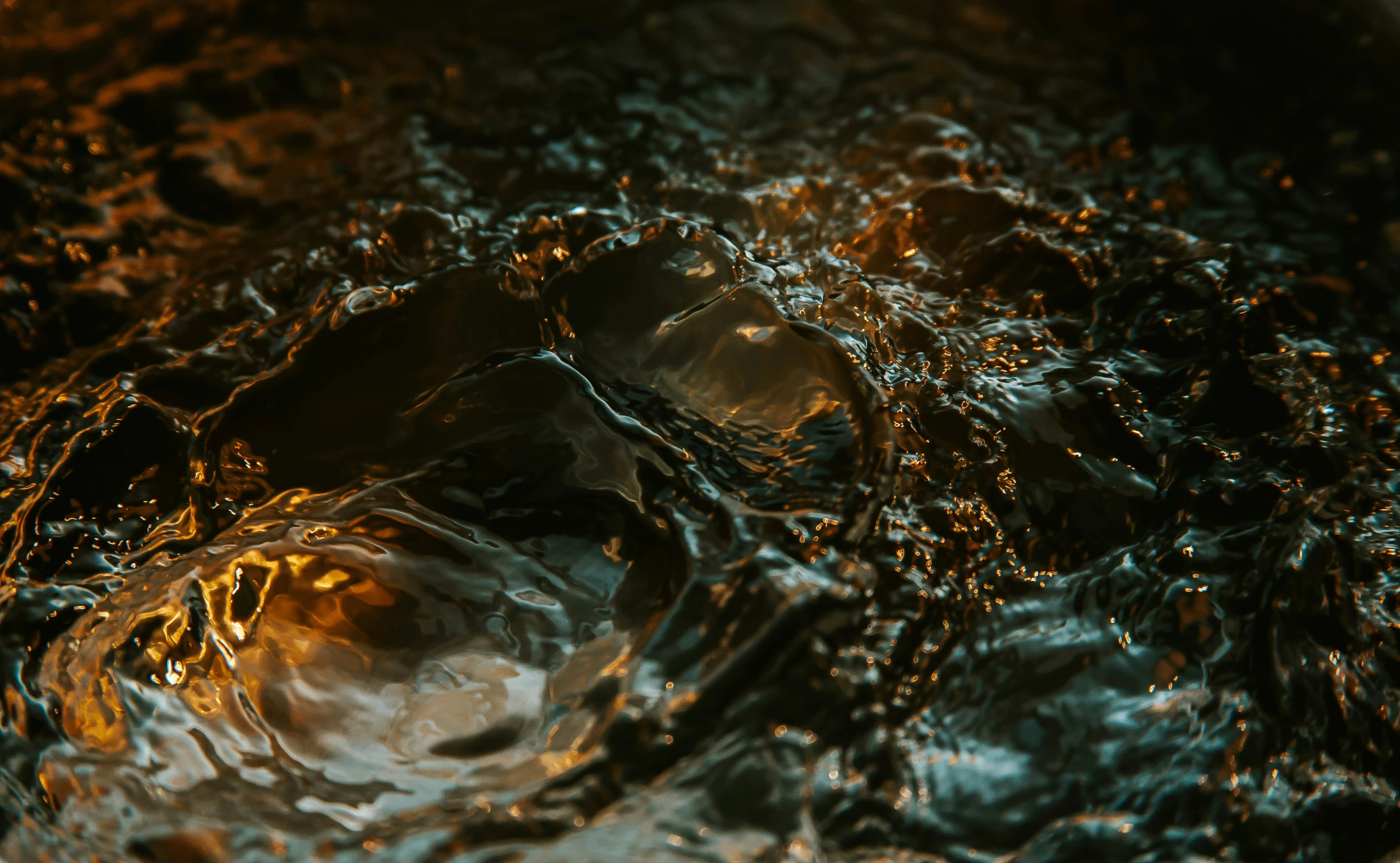 a small bowl of food next to some water