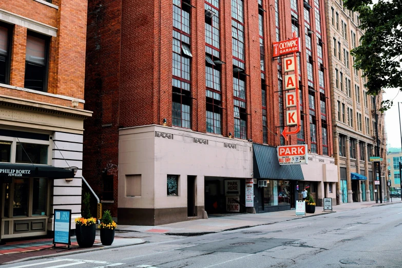 a street in front of a tall red brick building