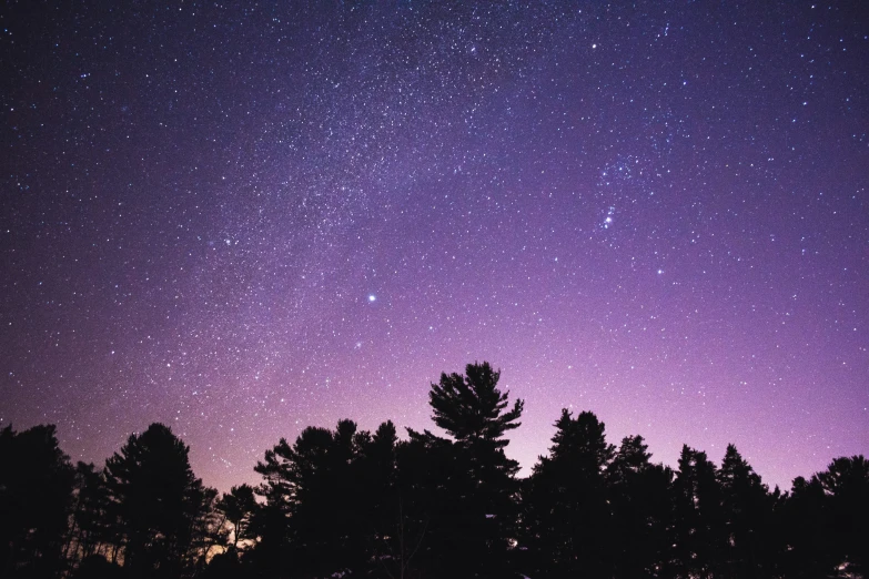 a purple and blue sky with stars