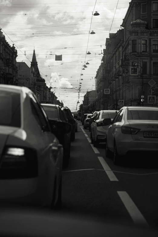 there is many cars on the street during a daytime time