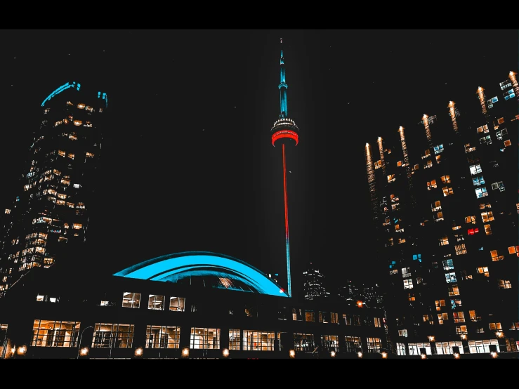 a building tower is shown at night in the city