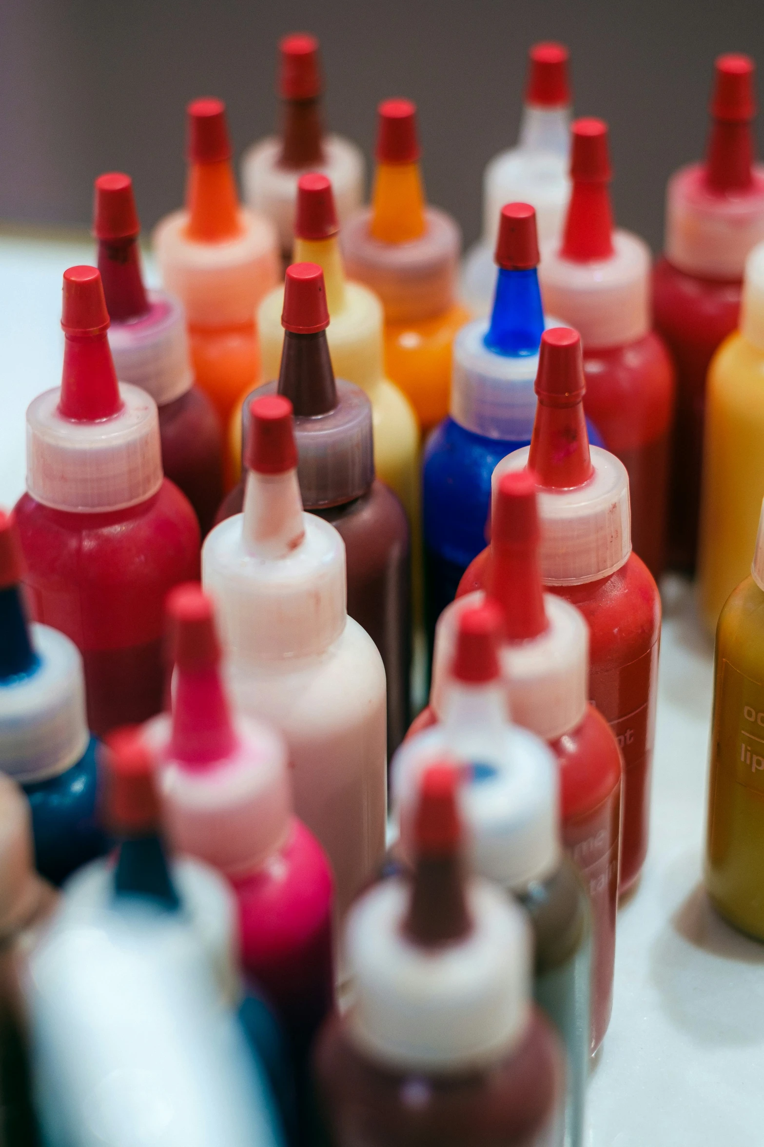 colorful liquids are lined up close to each other