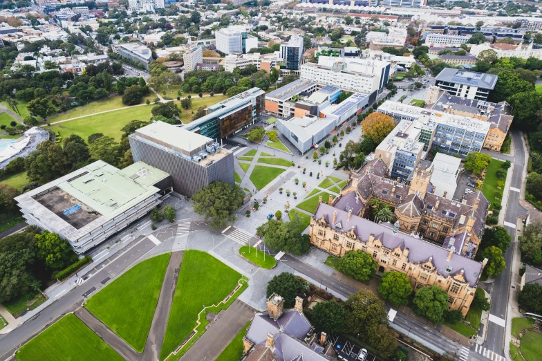 aerial view of buildings and fields in the city