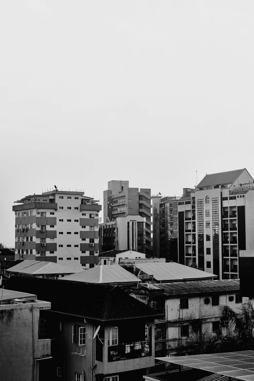 the silhouette of some buildings against the sky