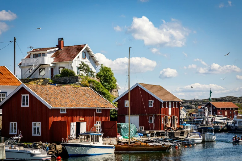 a group of houses in the water surrounded by buildings