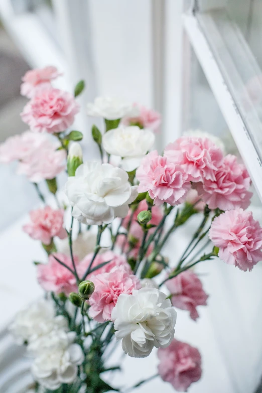 a vase filled with flowers on top of a table