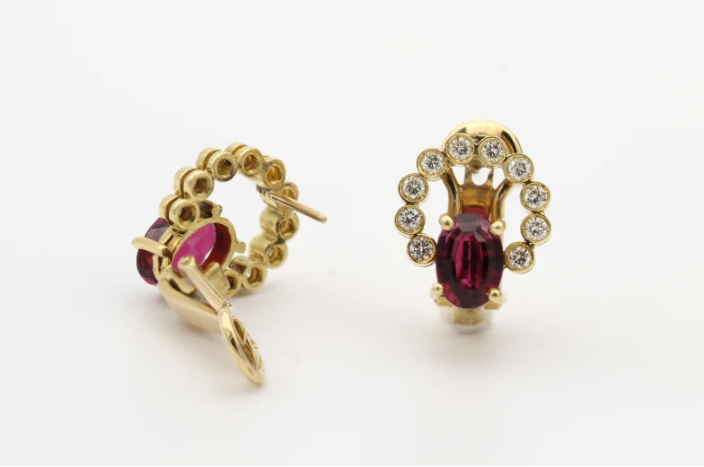 two gold plated ring styles with diamonds and gats