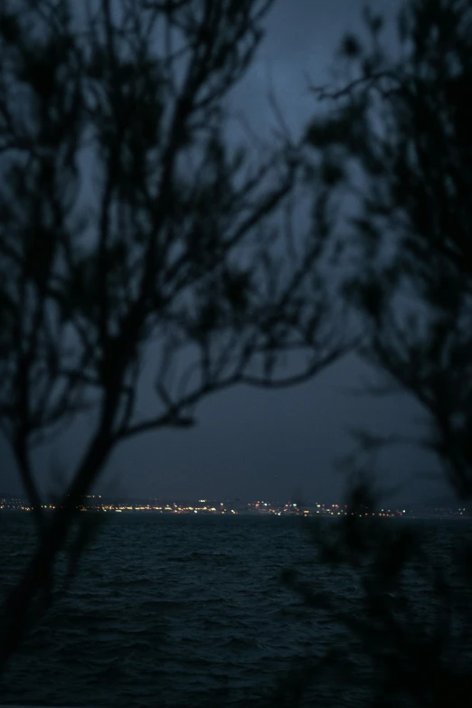 view of the bay at night from across the water