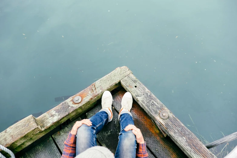 feet up on a dock looking at water