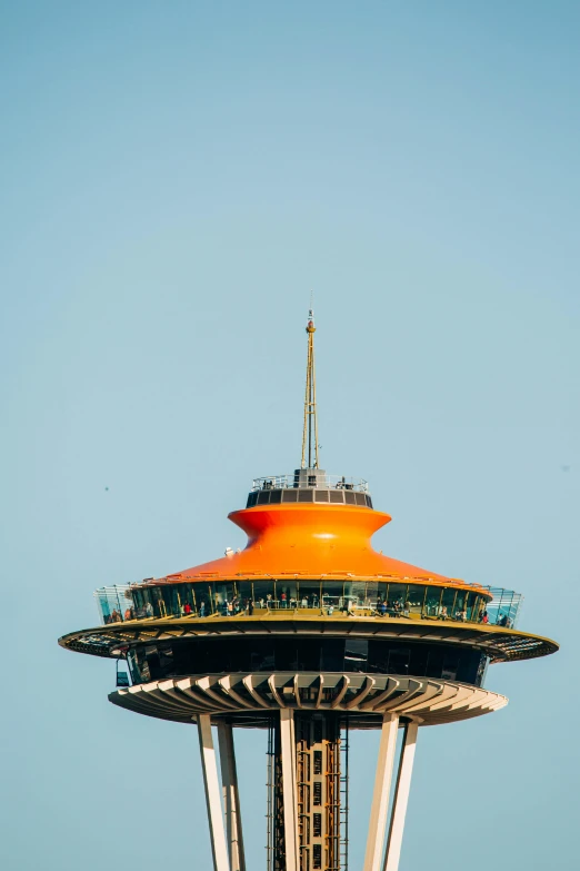 a large orange dome building sitting in the middle of a sky