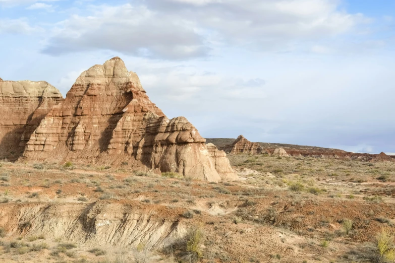 rocks and scrub brush along side an arid field