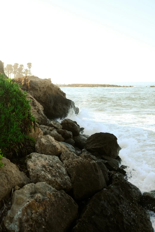 a beach on a very steep rock shore