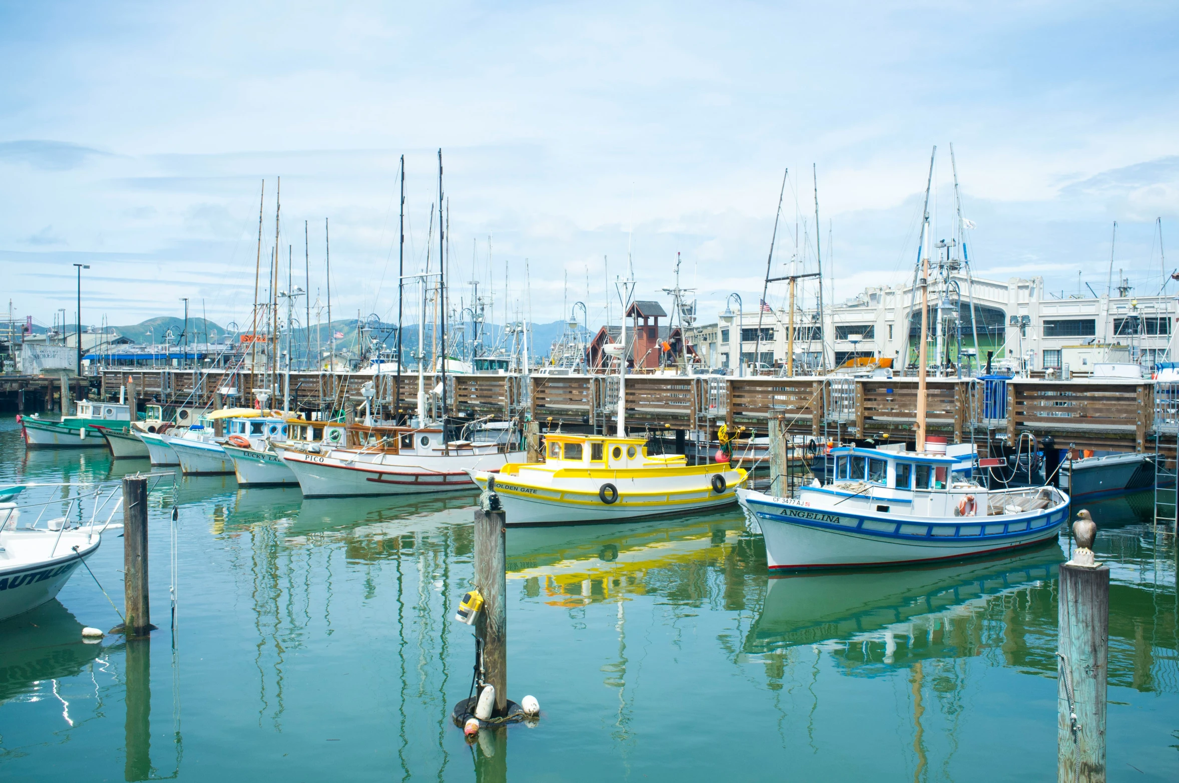 a group of boats docked in the harbor