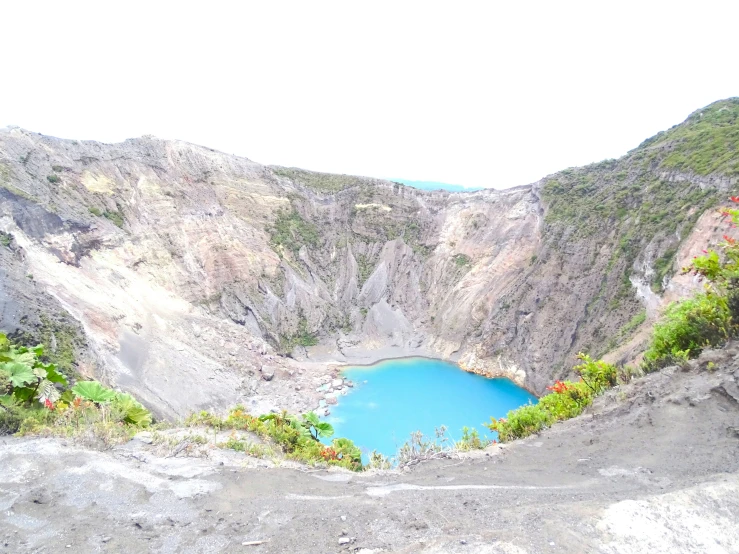 blue water in the middle of an open canyon