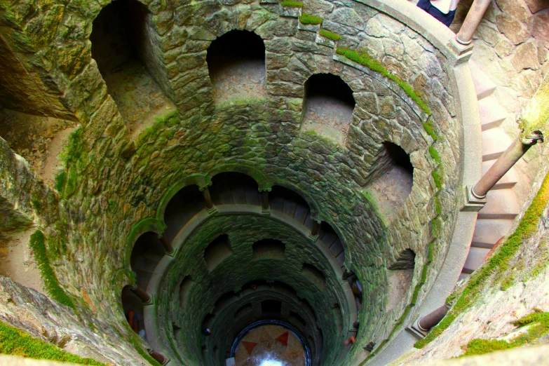 an old and abandoned tower with steps made into a spiral staircase