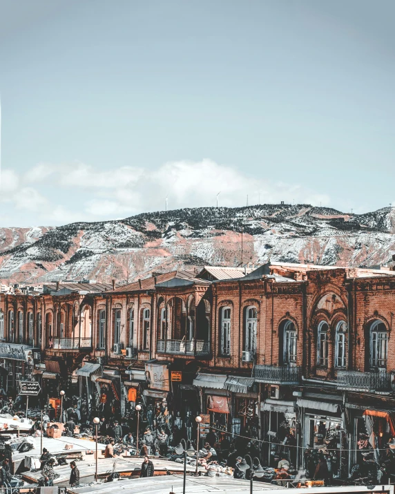 an image of a building in the winter with people walking around