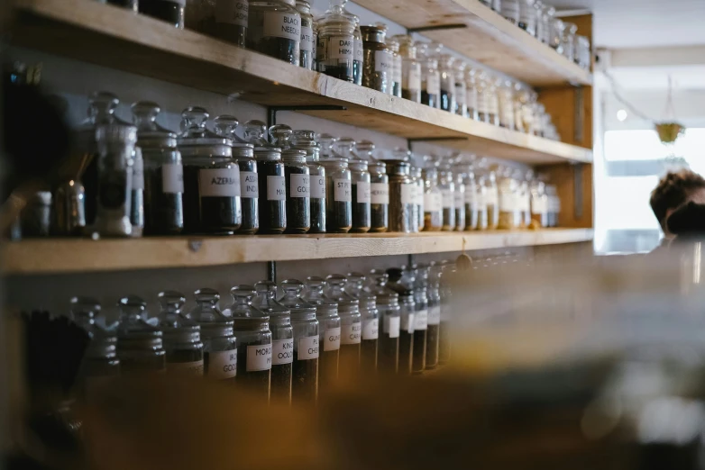 multiple shelves of jars of all sorts along with other things