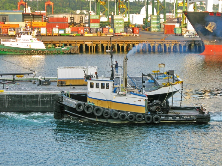 there is a large boat on the water with land in the background