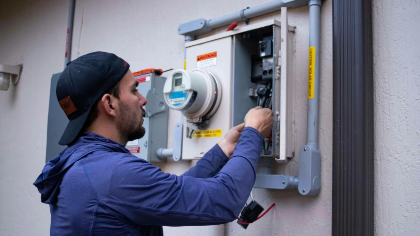 a man working on an electrical device