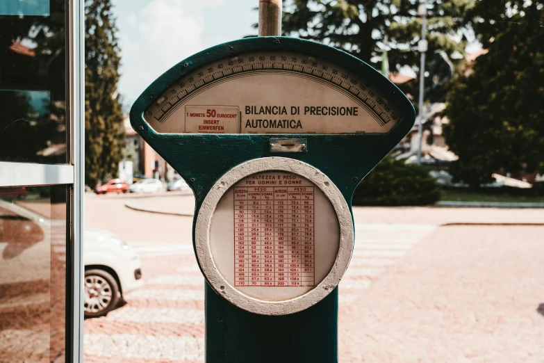 a parking meter on the side of the road