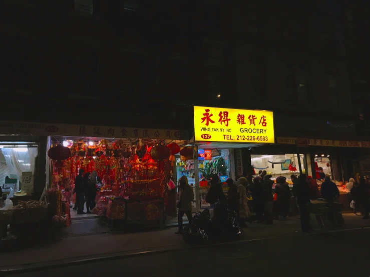 an oriental style market on a city street at night