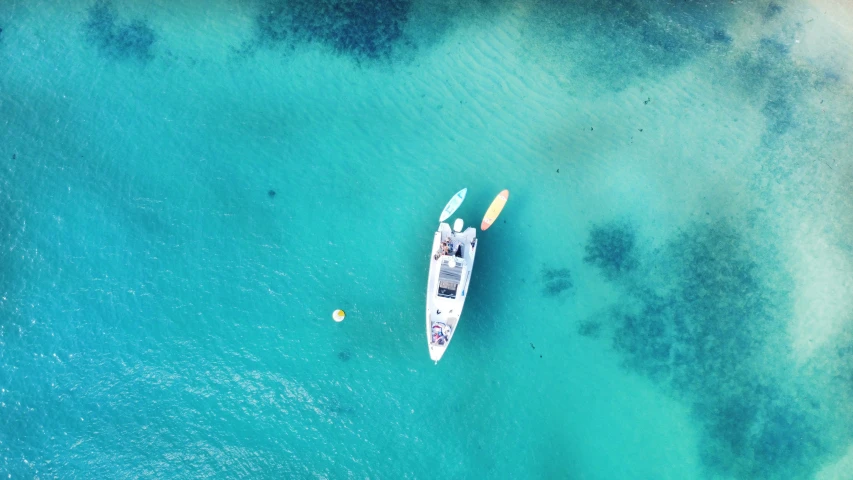 an aerial s of two boats floating in the ocean