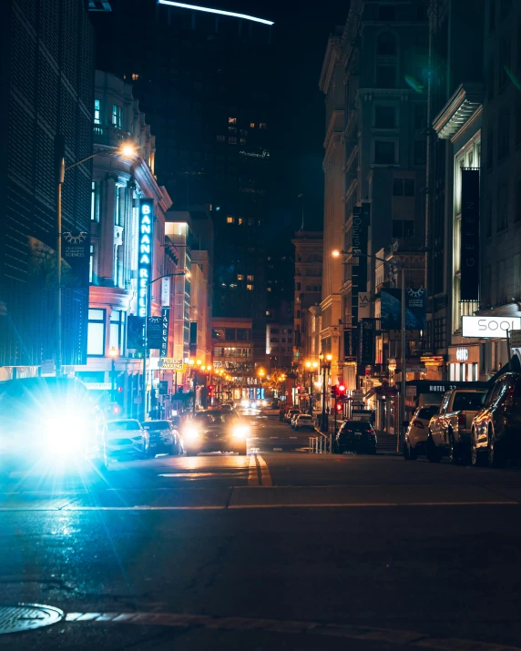 a couple of cars on the street at night