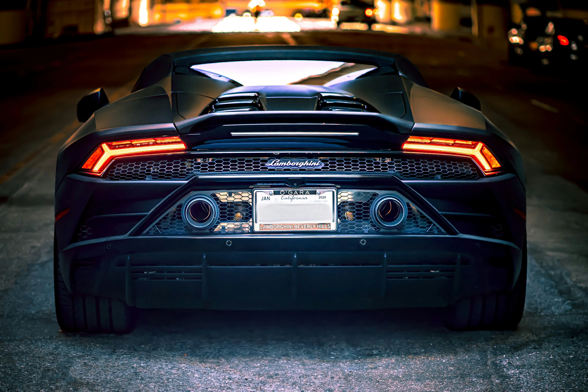 a sport car sits parked in a parking lot