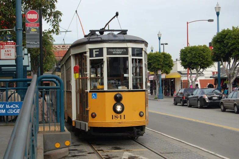 a trolly trolley on a street on a city street