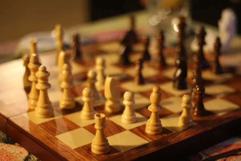 a set up of chess pieces are shown on a table