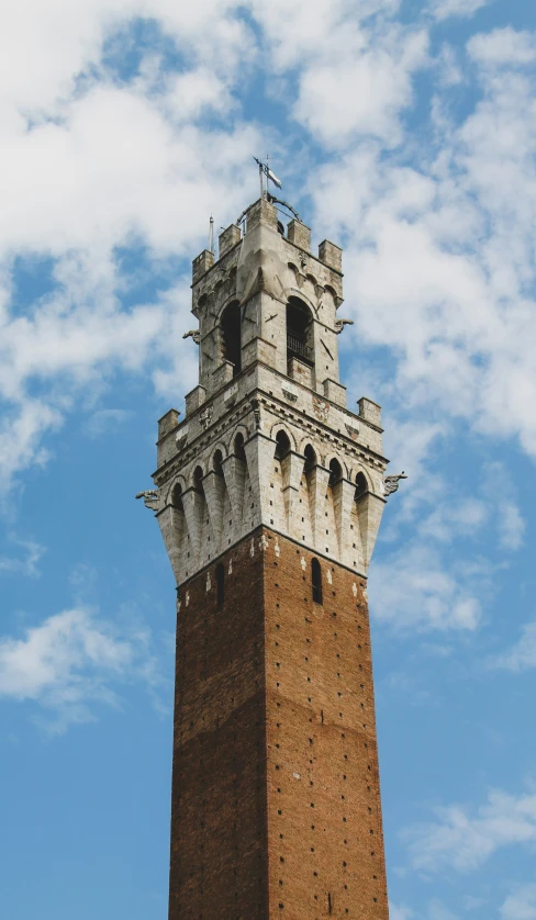 a tall brick tower under a blue sky