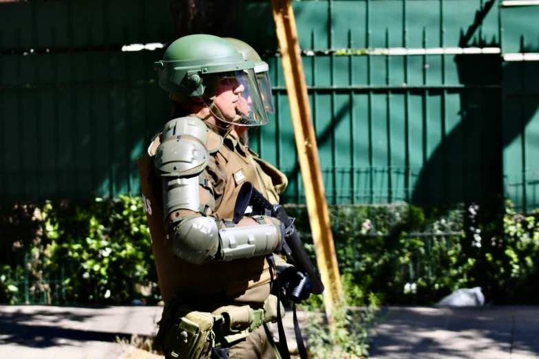 a soldier with a gun on his shoulder