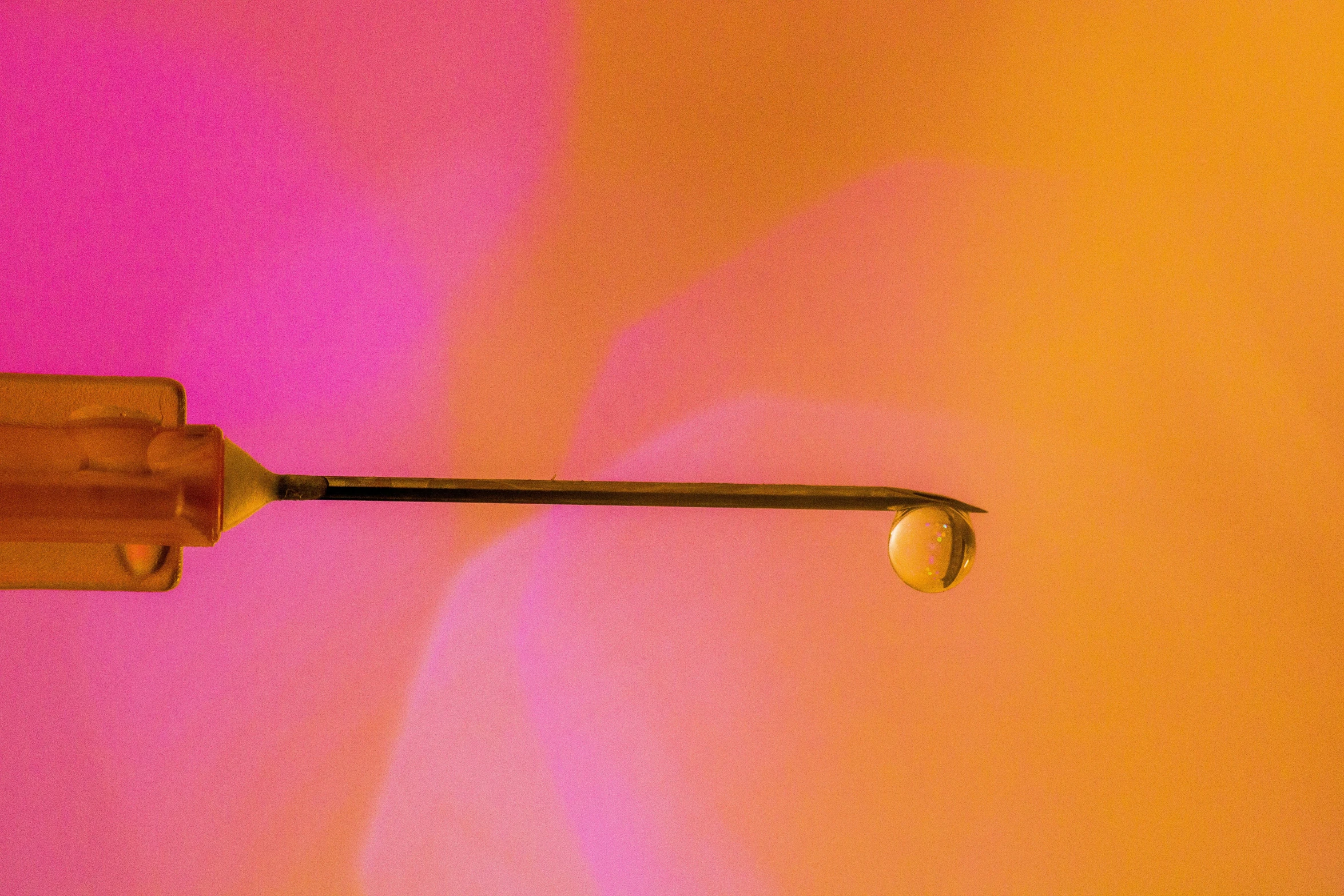 an umbrella is shown against a colored wall