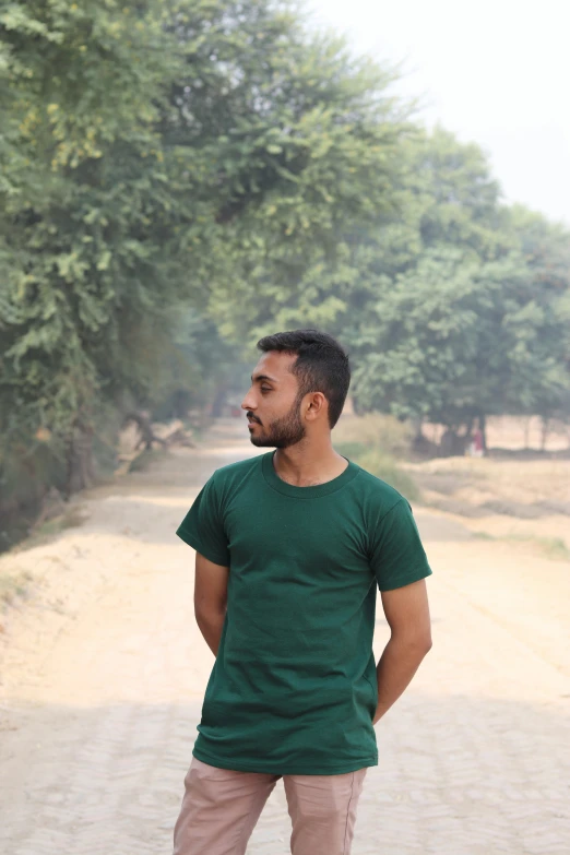 a man standing on the side of a road