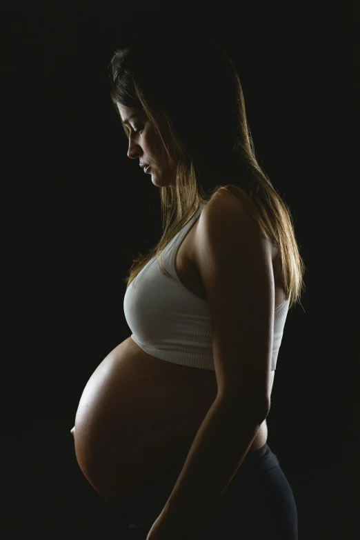 an image of a pregnant woman posing for a po