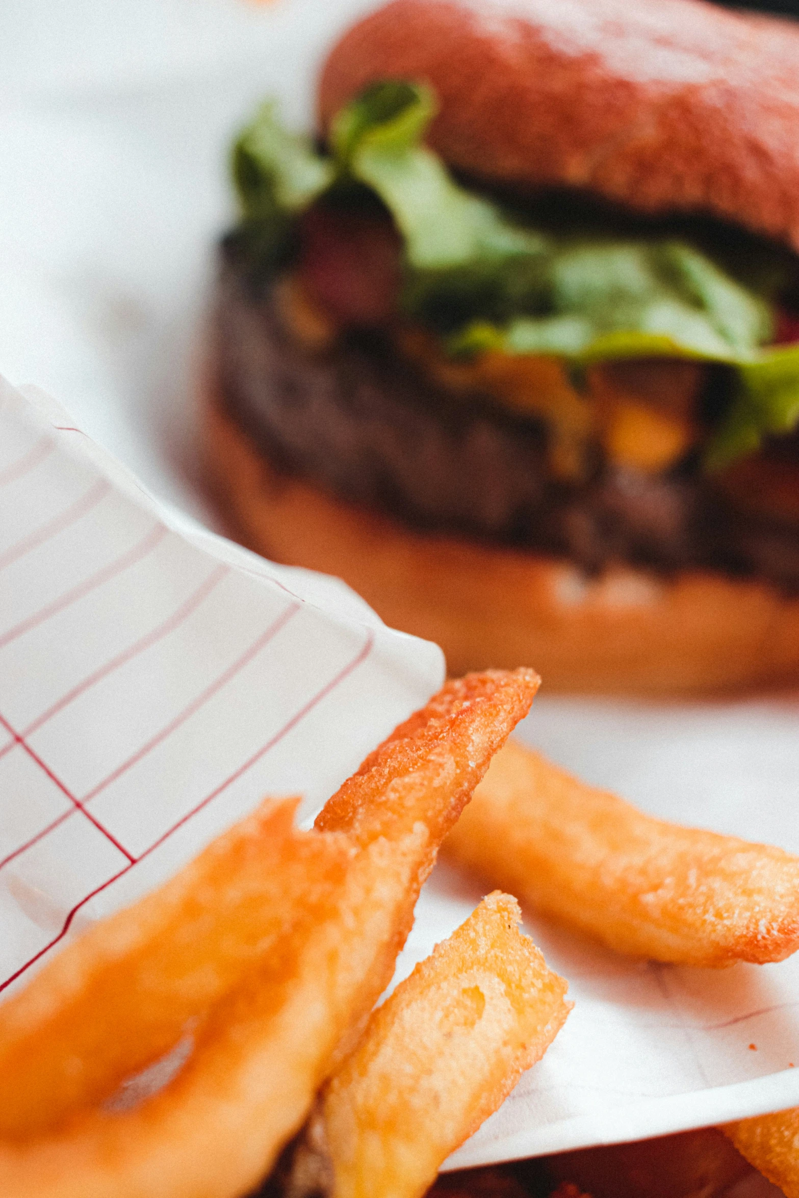 a hamburger and some fries on the table