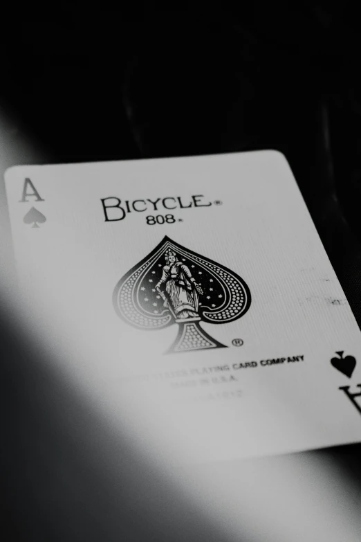 a bicycle club playing cards on top of a table