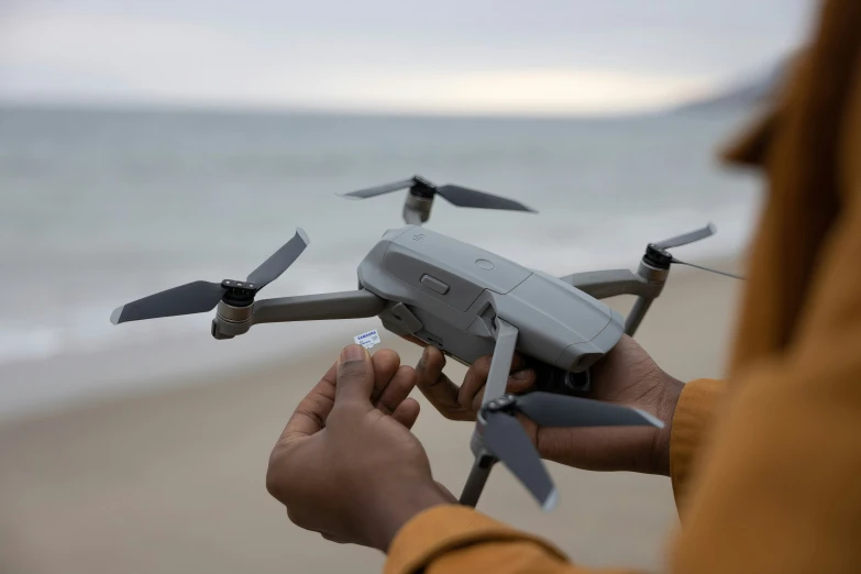 there is a man holding a remote control airplane