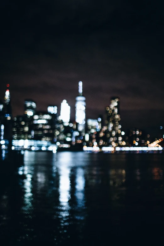 the city skyline in front of a night sky line