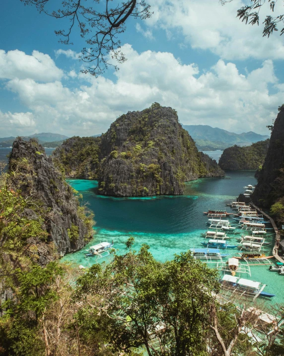 a beautiful beach that is surrounded by mountains