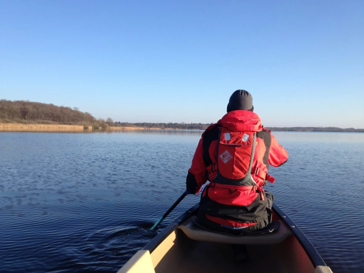 a person in a boat on a body of water