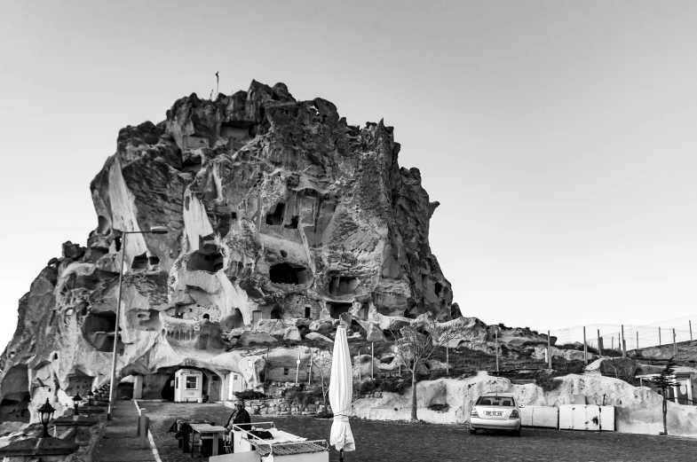 the large stone structure has many holes and caves