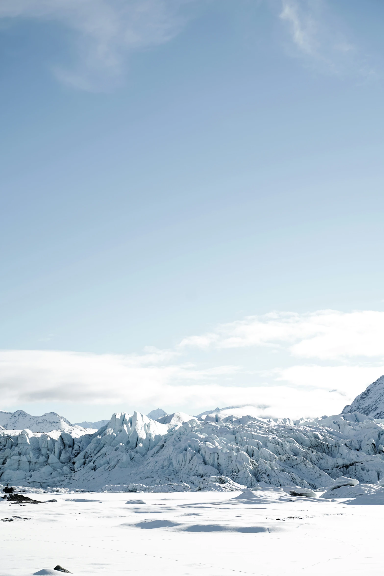 a person is on skis with the mountains behind them