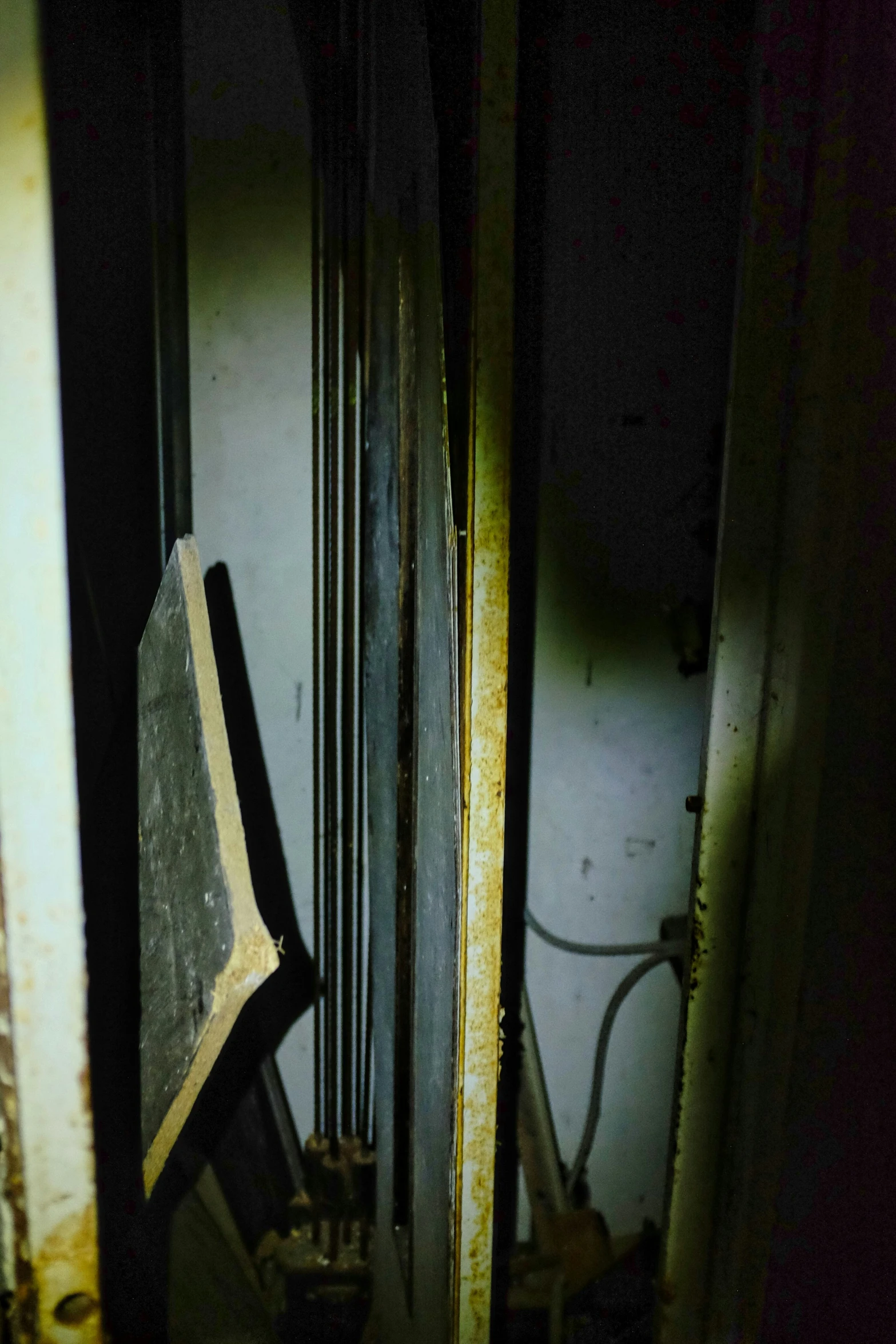 old kitchen items and appliances left out in a darkened area