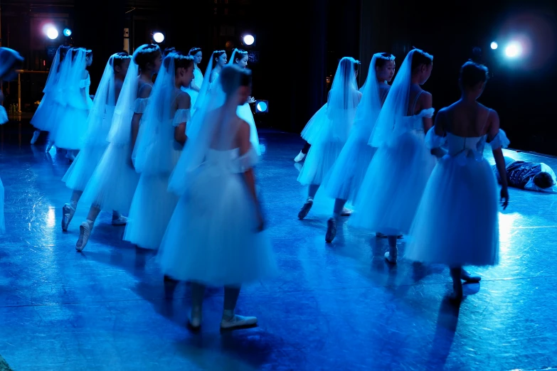 a bunch of young women in gowns at the wedding