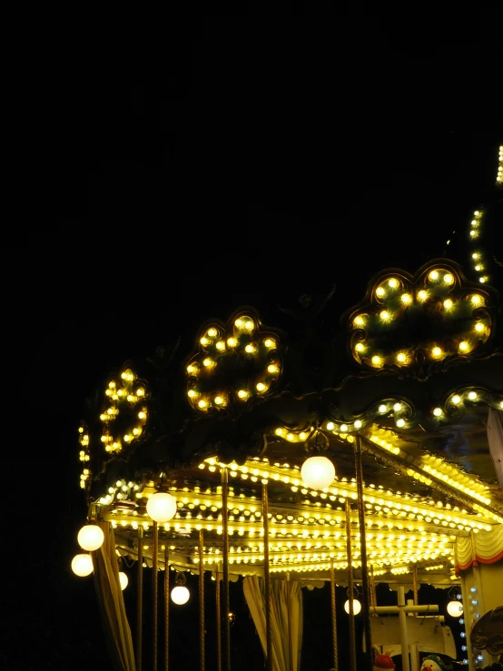 several lights are on the merry go round