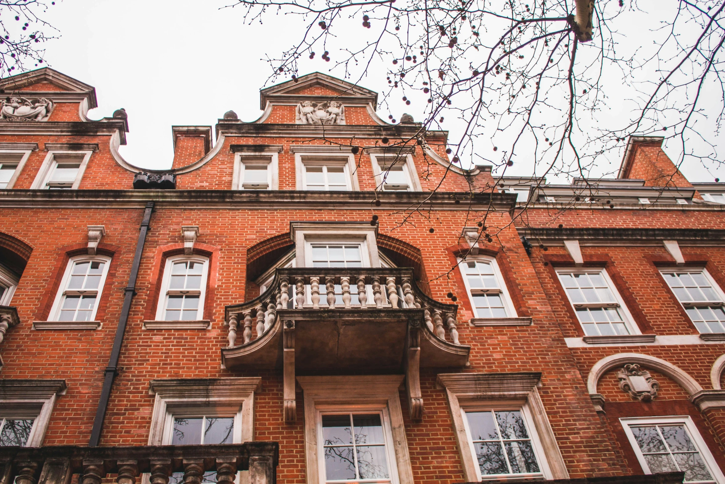 an old brick building with lots of windows