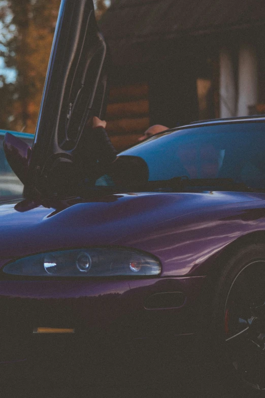 a closeup of a car with the door open